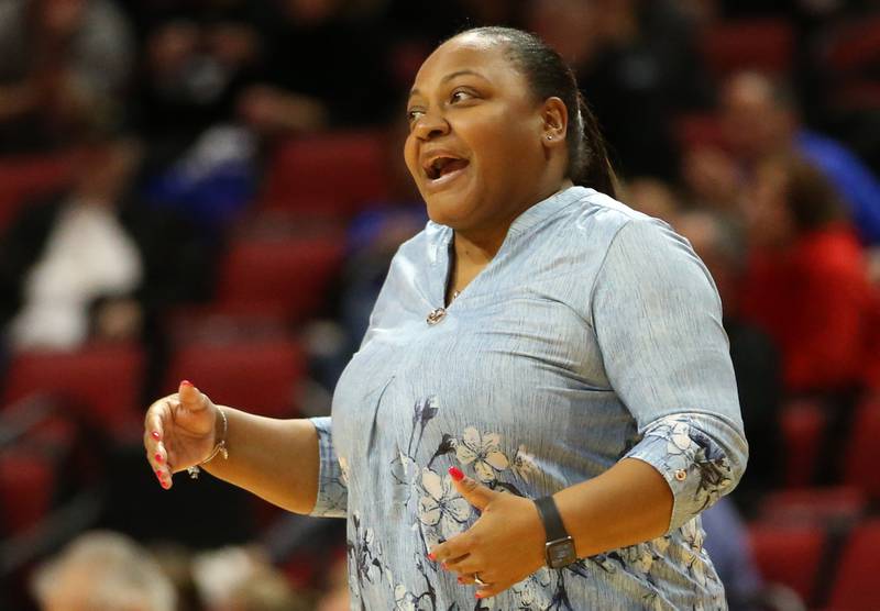 Joliet Catholic's head coach LaKisha Cameron shouts out a message to her team while playing St. Francis in the Class 3A semifinal game on Friday, Nov. 11, 2022 at Redbird Arena in Normal.