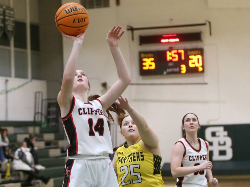 Amboy/Ohio's Jillian Anderson eyes the hoop while moving into the lane around Putnam County's Teaghan Sarver during the Class 1A Regional semifinal game on Tuesday, Feb. 18, 2025 at St. Bede Academy.