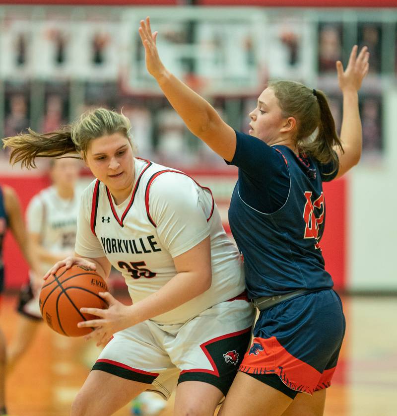 Yorkville's Madison Spychalski (35) plays the ball in the post against Oswego during the 13th annual Hoops 4 Hope Communities vs. Cancer basketball event at Yorkville High School on Saturday, Jan 28, 2023.