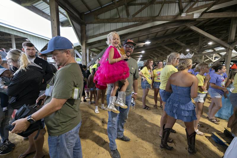 Wrenly Pedersen is picked up by dad Mike after competing in the Ogle County Little Miss pageant Wednesday, July 30, 2025.