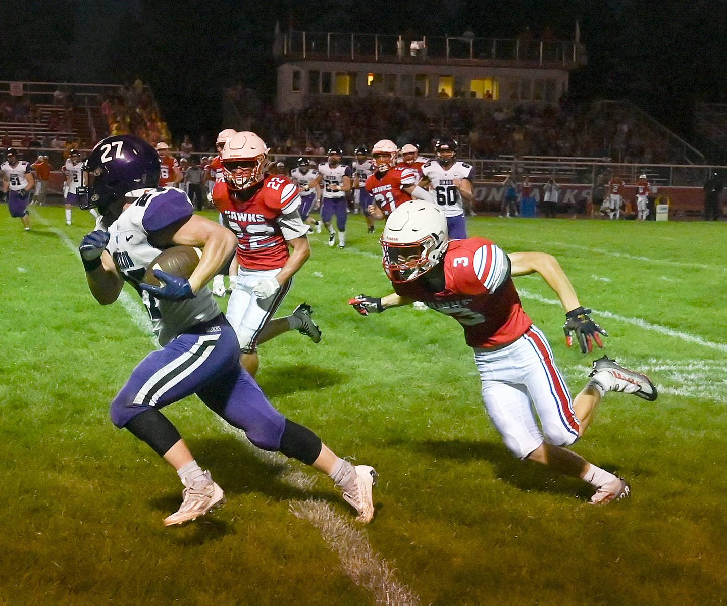 Dixon's Eli Davidson runs the ball up the sideline while being trailed by Oregon's Gabe Eckerd and Jayden Jenkins Friday, Aug. 26, 2022.