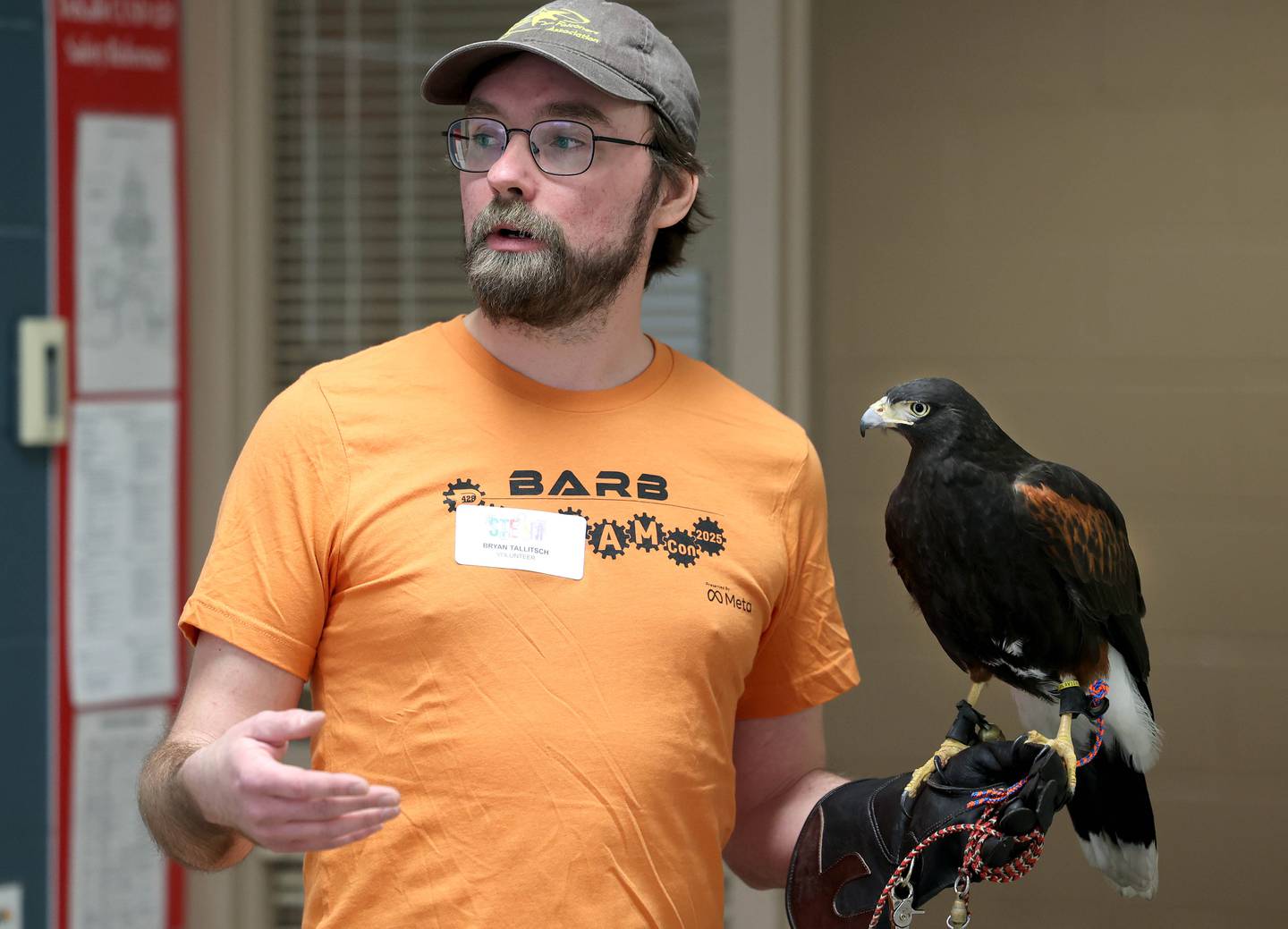 Bryan Tallitsch, District 428 IT manager, along with Soyuz, his Harris’s Hawk, talk about how technology is used in modern falconry Saturday, April 5, 2025, during Barb STEAMCon at Dekalb High School. The event featured sessions focusing on the areas of science, technology, engineering, arts and math.