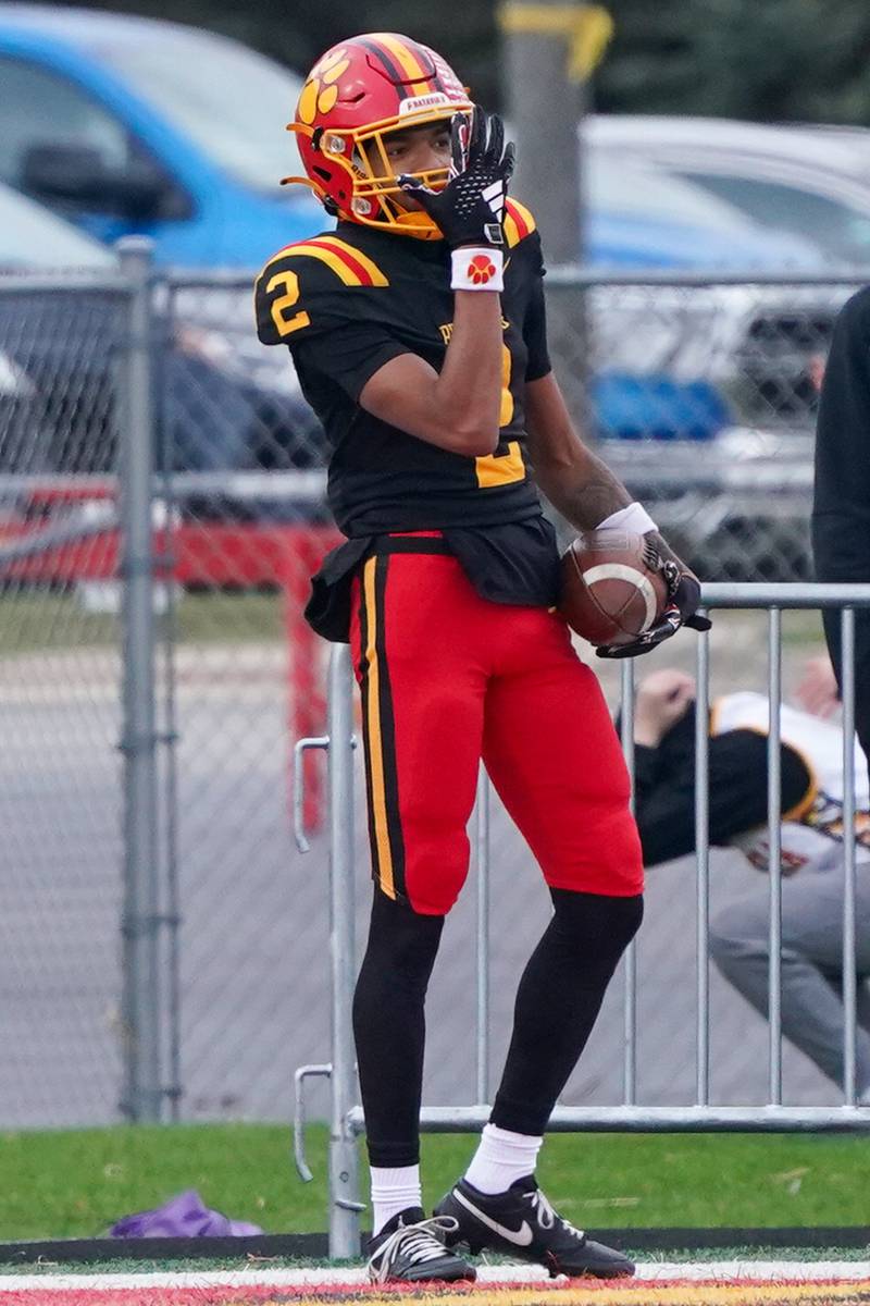 Batavia's Isaiah Brown (2) celebrates a touchdown against Downers Grove North with the “You can’t see me” gesture made famous by WWE wrestling star John Cena during a class 7A quarterfinal playoff football game at Batavia High School on Saturday, Nov. 16, 2024.
