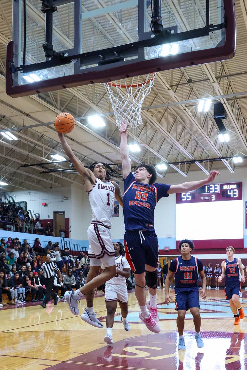 Kankakee's Lincoln Williams floats toward the basket under pressure during the Kays' 74-60 victory over Mahomet-Seymour on Tuesday, Dec. 2, 2025.