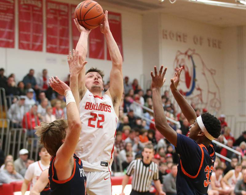 Streator's Christian Benning eyes the hoop as Pontiac's Henry Brummel and Amazin King defend during the Class 3A Regional semifinal game on Wednesday, Feb. 22, 2024 at Pops Dale Gymnasium.