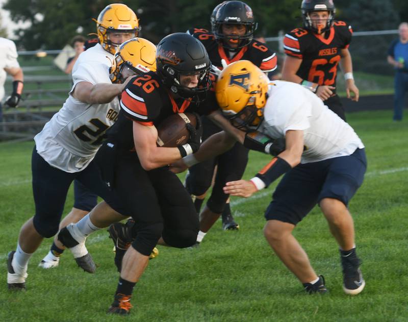 Milledgeville's Kolton Wilk runs for a gain against Freeport Aquin.