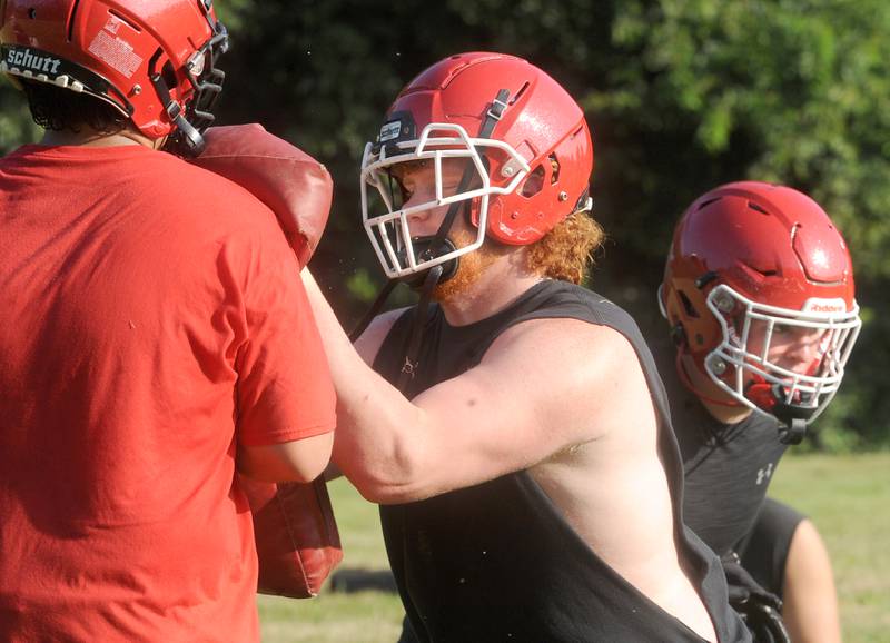 Yorkville's Logan Brasfield blocks a teammate during football practice at Yorkville High School on Tuesday, Aug 8, 2023.