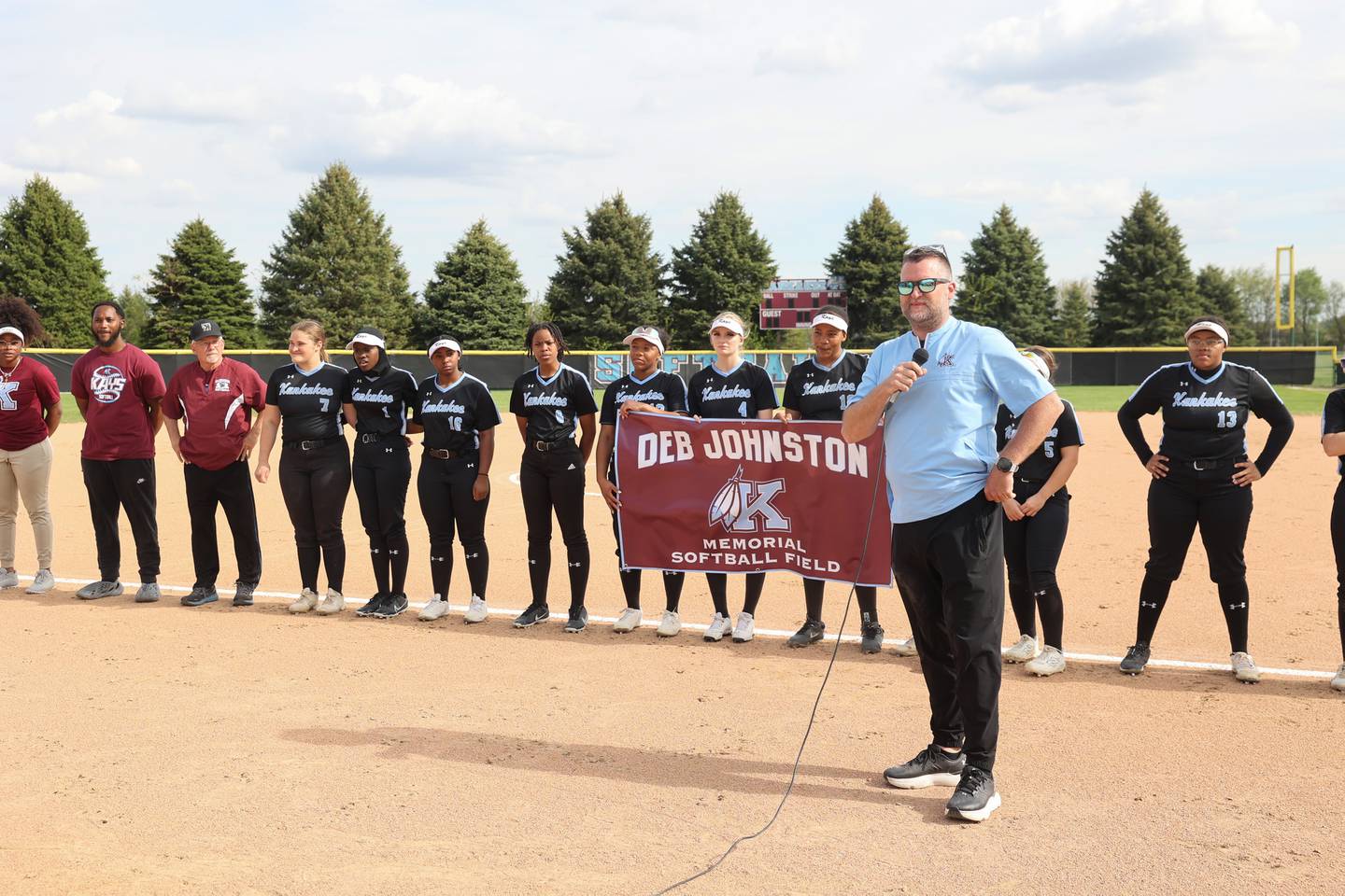Kankakee High School athletic director Ronnie Wilcox pauses while reflecting on the impact the late coach Deb "Coach J" Johnston had on the district during a pregame ceremony dedicating the Deb Johnston Memorial Softball Field at Kankakee High School on Wednesday, May 7, 2025.