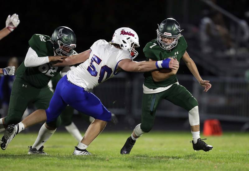 Bartlett's Koleman Salyers (7) tries to avoid a tackle by a Glenbard South player Friday September 23, 2022 in Bartlett.