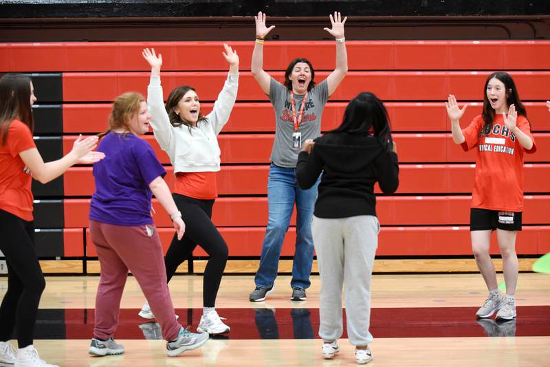 Bradley-Bourbonnais PE teacher and girls volleyball coach Leigh Reiniche (gray shirt) joins the celebration after Leah Mason scored a goal in soccer during an adapted PE class Friday, April 4, 2025. Joining in the celebration, from left, are Jocelyn Zettergren, Ella Schneider, Ella Walter and Emmeline Sovinski.