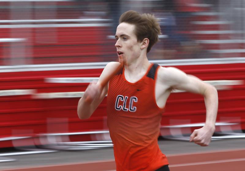 Crystal Lake Central’s James Durcan runs the second leg of the 4 x 800 meter relay during the IHSA Class 3A Huntley Boys Track and Field Sectional Wednesday, May 18, 2022, at Huntley High School.