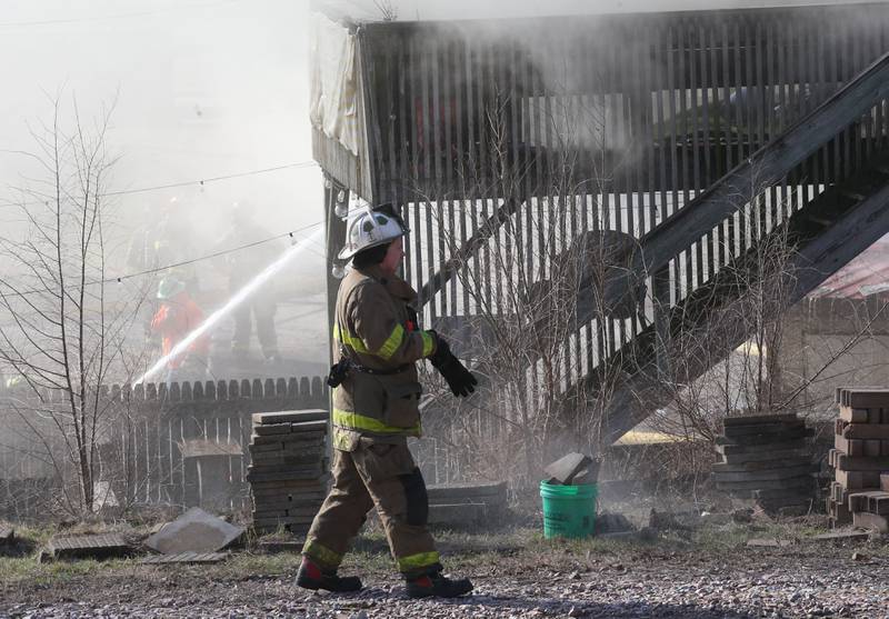 Todd Bogatitus, Spring Valley Fire Chief, walks to the back of a structure fire at the former Platform 31 tavern on Monday, March 24, 2025 on Water Street in Peru. The fire was upgraded to a three-alarm summing ire departments from La Salle, Utica, Mendota, Tonica, Ottawa, Spring Valley, Ladd, Lostant, Cedar Point, Troy Grove and Peru responded to the fire.