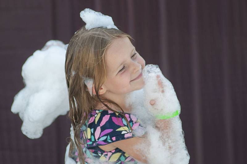 Laikyn Assenmacher, 4, has fun with suds Saturday, July 30, 2022 during Morrison’s Shuckfest. A sudsy pool party was just one of the fun things to to do at the new sweet corn centered festival.
