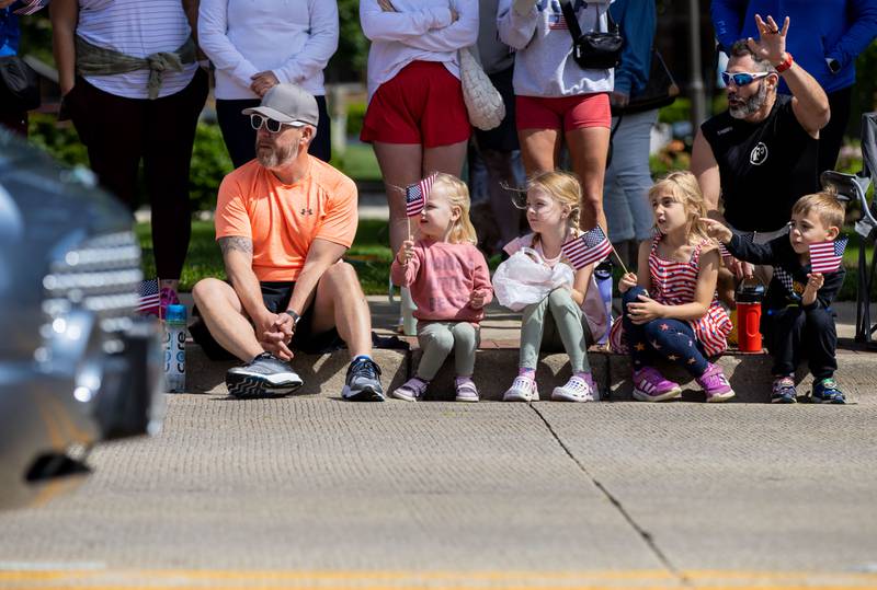 Spectators watch the St. Charles Memorial Day Parade process down Main Street in downtown St. Charles on Monday, May 26, 2025.