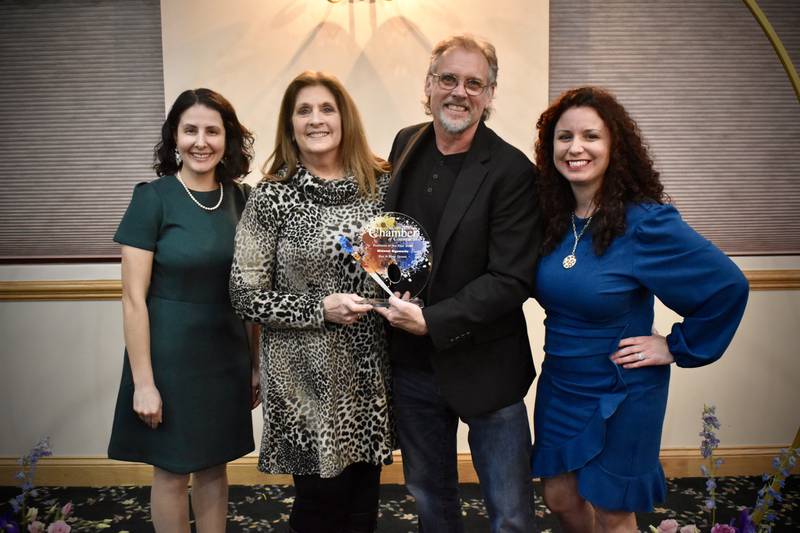 Rose and Ray Grossi (center) accept the Grundy County Chamber of Commerce's Business of the Year award from Megan Borchers (left) and Christina Van Yperen (right).