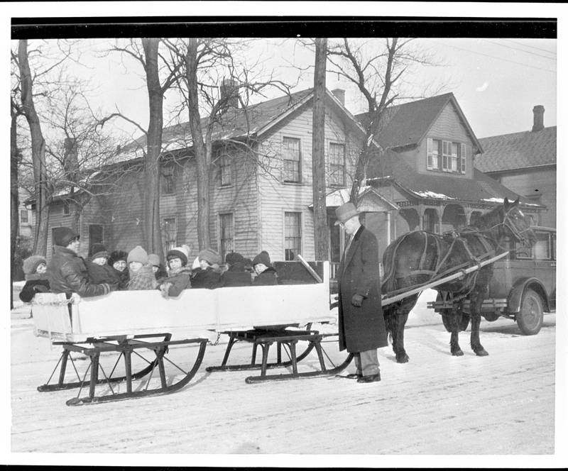 A group of people enjoy a bobsled ride in 1929 Joliet.