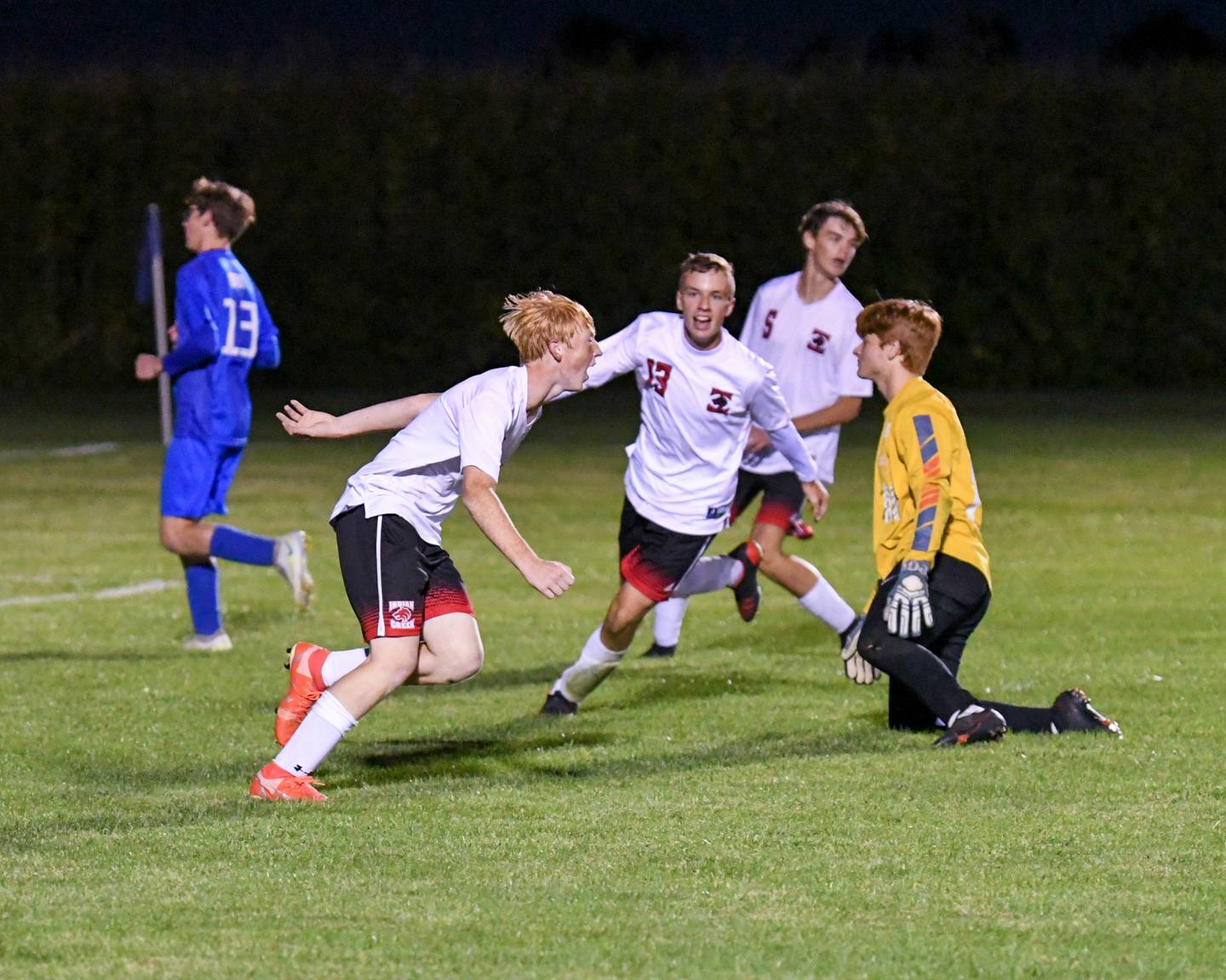 Indian Creek’s Tyler Bogle, left, and teammate Lucas Odle, center, are all smiles after Tyler scored a goal in the second half of the game over Hinckley-Big Rock’s goalkeeper Keegan Fitzpatrick on Monday Sept. 26th held at Hinckley-Big Rock High School.