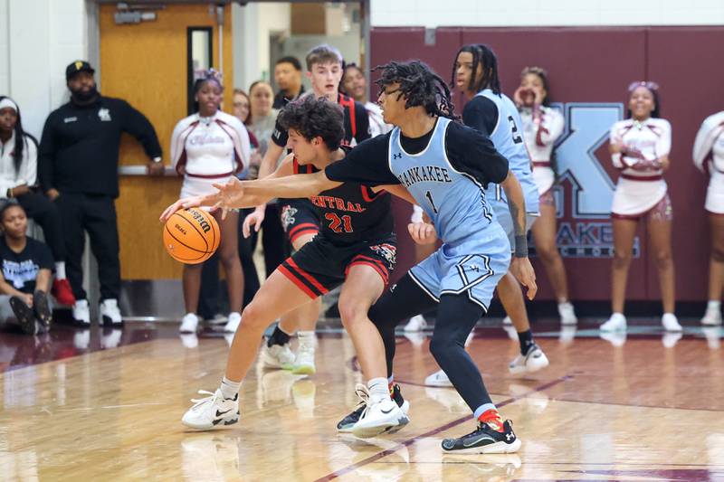 Lincoln-Way Central's Alex Panos fends off Kankakee's Lincoln Williams during the Kays' 54-50 victory over Lincoln-Way Central in the 75th Kankakee Holiday Tournament maroon bracket championship on Sunday, Dec. 28, 2025.