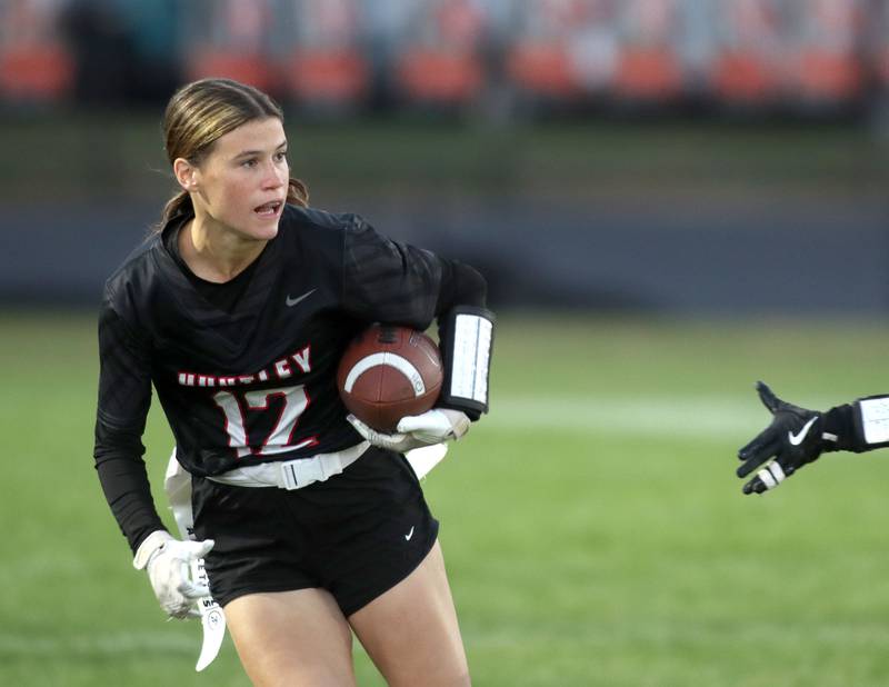 Huntley’s Aubrina Adamik picks up some yards against Antioch in IHSA Regional varsity flag football action at Crystal Lake Central High School in Crystal Lake on Wednesday, Oct. 8, 2025.