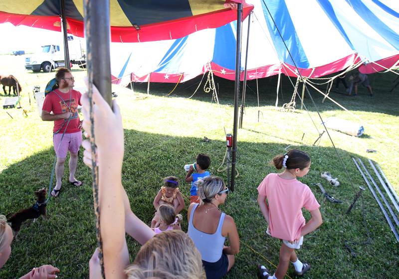 Leo Acton, (left) leads a group on behind-the-scenes tour of the Culpepper & Merriweather Circus on Monday, June 23, 2025 at Boggios in Granville. The circus held two shows and was sponsored by the Village of Granville and Boggio's Orchard & Produce, LLC