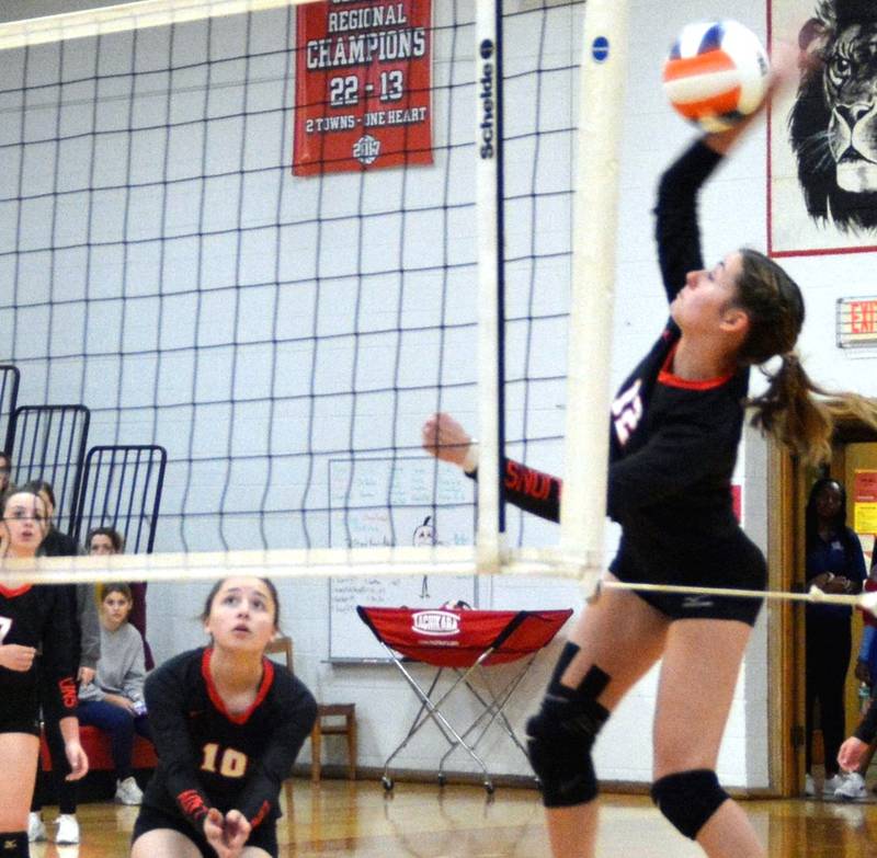 Bella Drummer makes a hit for LaMoille in Wednesday's action in the Little Ten Conference volleyball tournament at LaMoille's Dean Madsen Gymnasium. The tournament finals will be held Saturday.