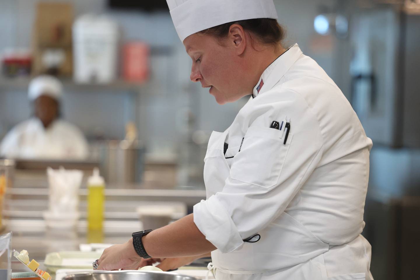 Joliet Junior College Chef Katey Sopko demonstrates cutting an onion with her class at the City Center Campus. Monday, Aug. 29, 2022, in Joliet.