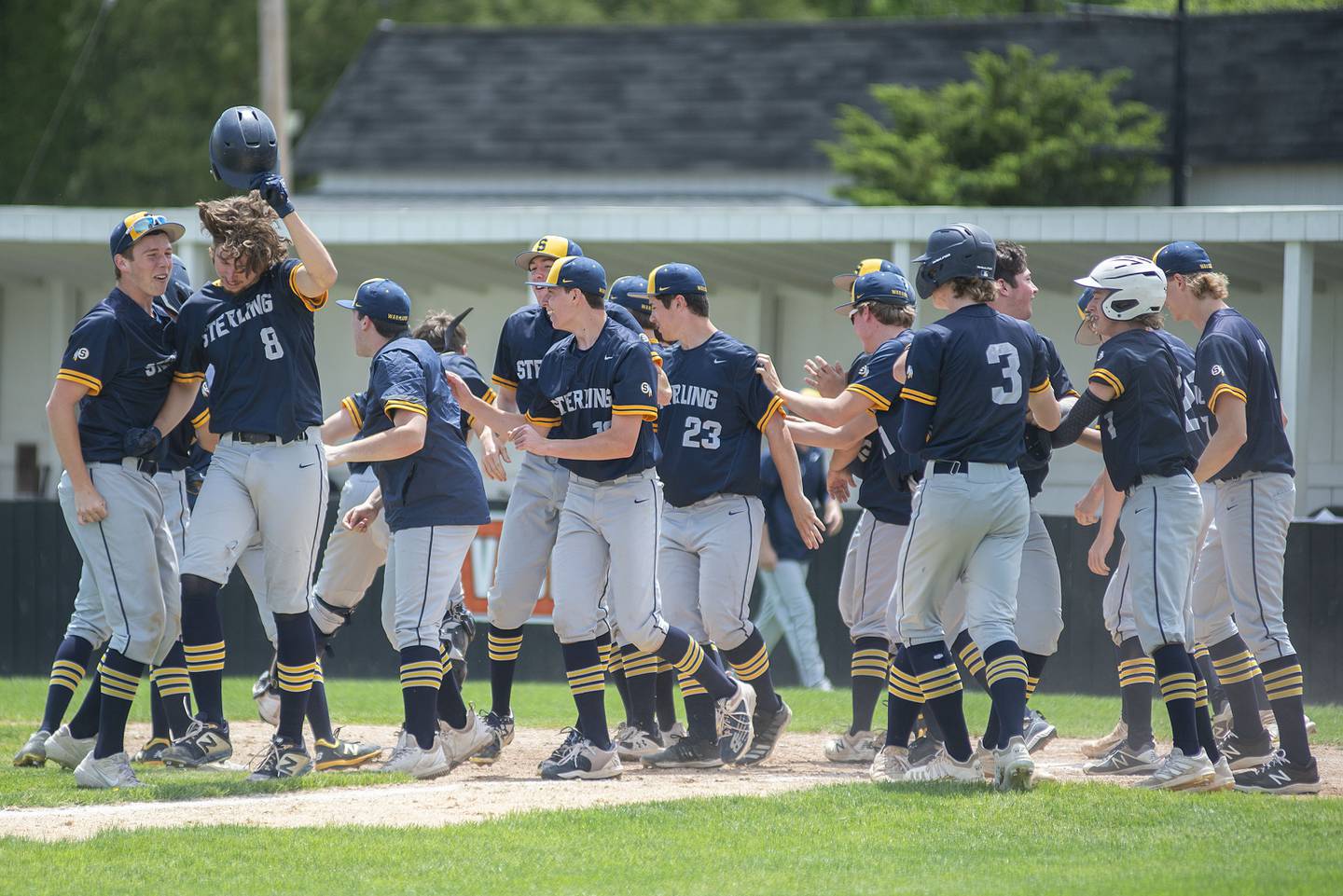 Sterling celebrates Blake Nettleton’s (right) two-run homer against Dixon on Saturday, May 28, 2022 to put the Warriors up 3-1.