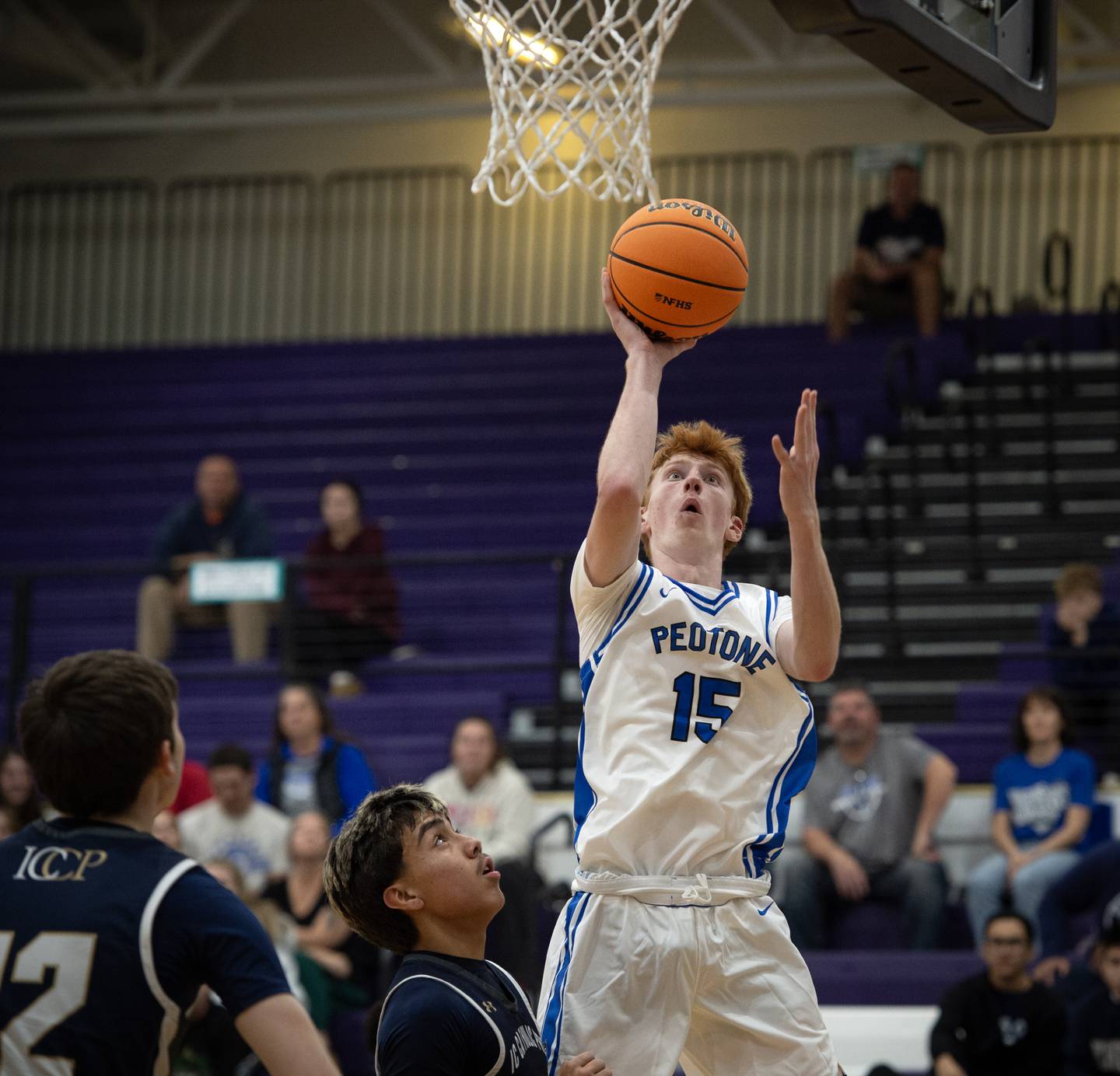 Peotone's Ethan McNeill, right, elevates for a shot against IC Catholic in the Thanksgiving tournament at Manteno High School on Monday, November 24, 2025.