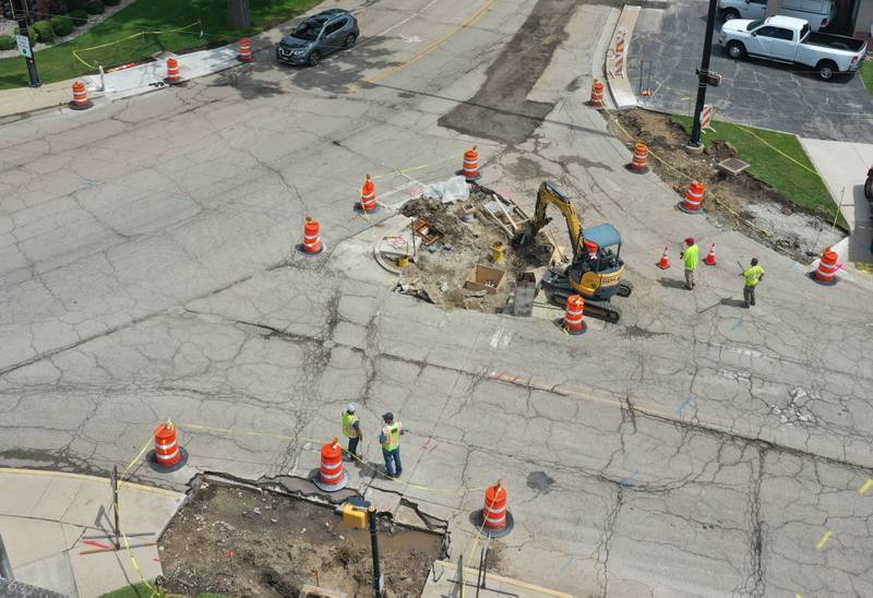 Crews work in the intersection of  West Street and U.S. 6 on Wednesday, July 31, 2024 in Peru. A long-term construction project is in full swing involving road patching, milling and resurfacing U.S. Route 6 from La Salle to Peru. In addition to roadwork, crews are rebuilding sidewalk ramps, drainage repairs, signal improvements and install raised reflectors. The 6.4 million project is expected to be fully completed by the end of summer 2025. Motorists are advised to use caution and be aware of traffic signals through the construction zones, which may cause increased wait times.