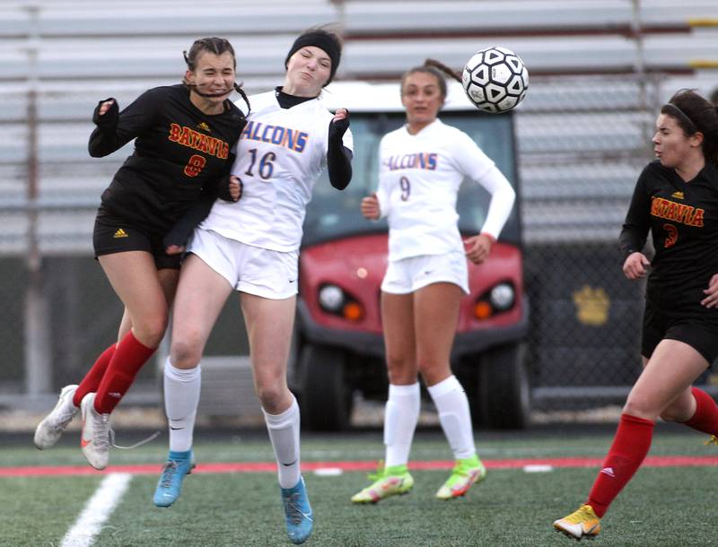 Batavia’s Brooke Carlson (8) and Wheaton North’s Macy Hutchinson (16) head the ball during a game at Batavia on Thursday, April 7, 2022.