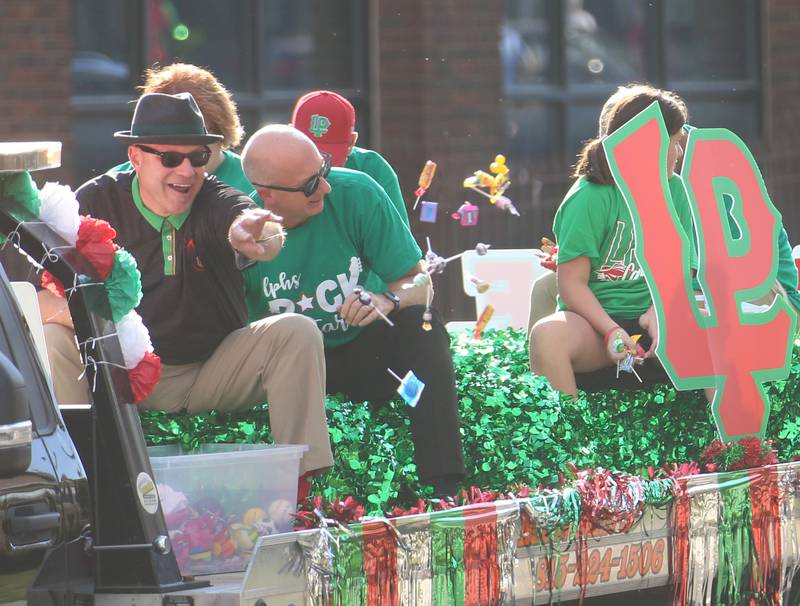 The L-P superintendent Steve Wrobleski throws candy during the L-P homecoming parade on Thuesday, Oct. 2, 2025 downtown La Salle.