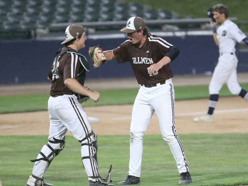 Joliet Catholic catcher Zach Pomatto celebrates with pitcher T.J. Schlageter after defeating Quincy Notre Dame during the late Class 2A state semifinal game on Friday, June 2, 2023, at Dozer Park in Peoria.