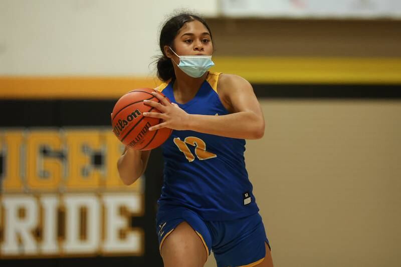 Joliet Central’s Joyce Tua-Link looks for a play against Joliet West. Tuesday, Feb. 8, 2022, in Joliet.