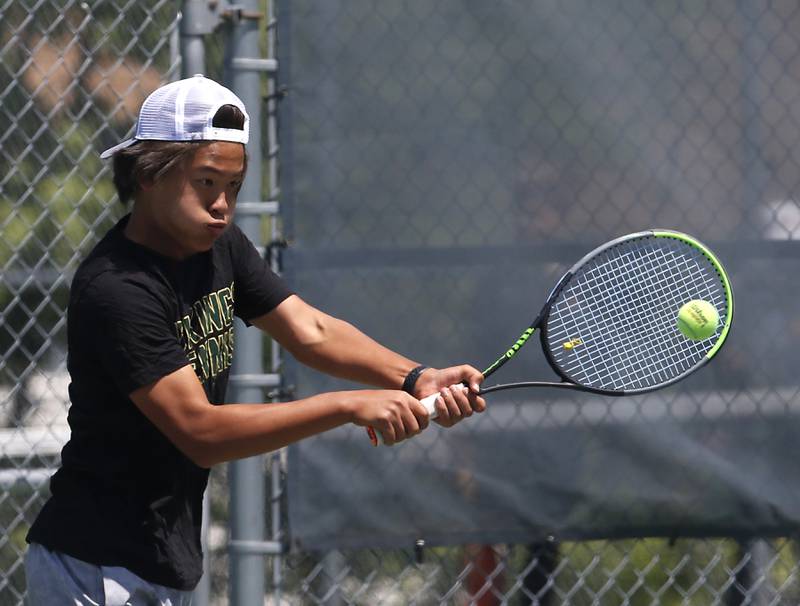 Fremd's Stanley Zeng returns the ball during an IHSA 2A boys doubles tennis match Thursday, May 25, 2023, at Buffalo Grove High School.