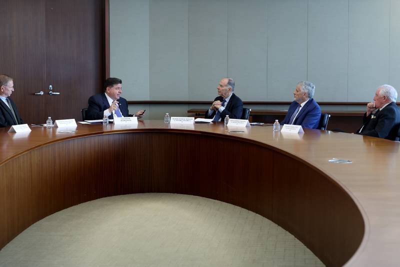 Illinois Gov. JB Pritzker, second from left, meets with former military generals and admirals in Chicago, Thursday, Oct. 16, 2025,  (Antonio Perez/Chicago Tribune via AP, Pool)