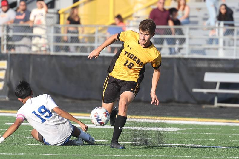 Joliet West’s Tommy Polacek evades the defense of Joliet Central’s Ramon Zavala on Tuesday, Oct. 3, 2023 in Joliet.
