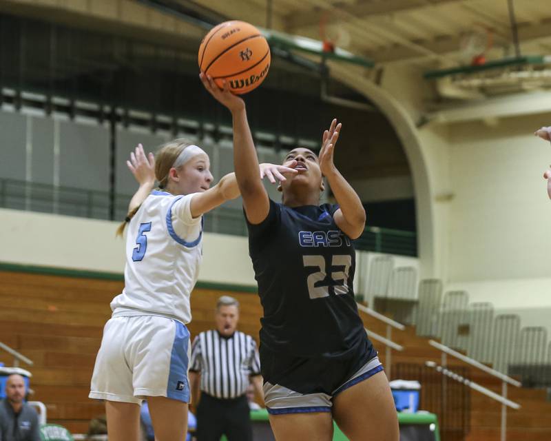 Oswego East's Inspire Fisher (23) puts up a shot under the basket during their York Thanksgiving Tournament matchup between Oswego East at Downers Grove South Friday, Nov 20, 2025 in Elmhurst.