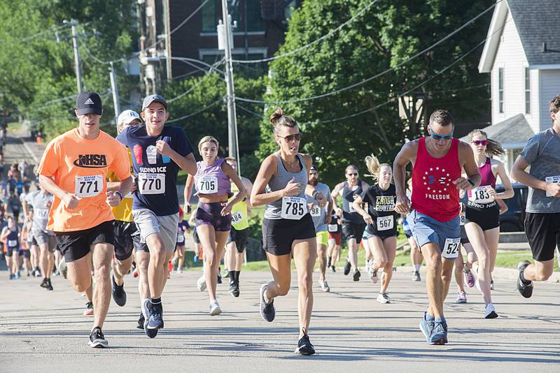 Runners in the 2022 Regan Run head north on Hennepin Avenue near the start of the 5K. The race returned to it’s original course on Saturday, July 2, 2022 after taking a cover hiatus in 2020 and a different route due to construction in 2021.