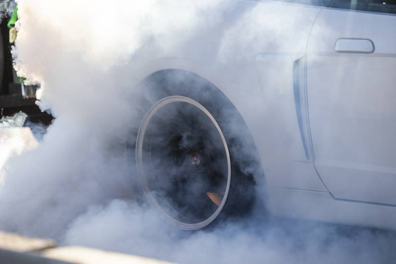 Rubber burns and smoke fill the air during a burnout Thursday, June 19, 2025, at the Rock Falls Block Party.