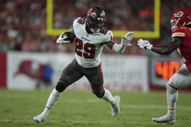 Tampa Bay Buccaneers running back Rachaad White (29) finds running room on the edge during an NFL football game against the ,Kansas City Chiefs Sunday, October 2, 2022 in Tampa, FL. The Chiefs defeat the Buccaneers 41-31. (Peter Joneleit via AP)