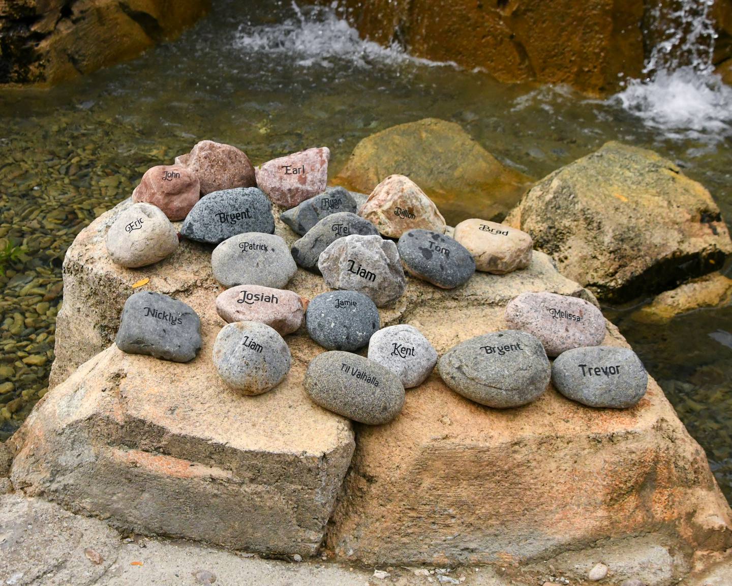 The names of veterans who died by suicide are carved on 22 rocks next to a waterfall at the Northwestern Medicine Kishwaukee Health & Wellness Center in DeKalb on Sunday, Sept. 21, 2025, at the second annual Be the One Walk to end veteran suicide. The rocks were then carried by loved ones throughout the 2.2-mile walk.