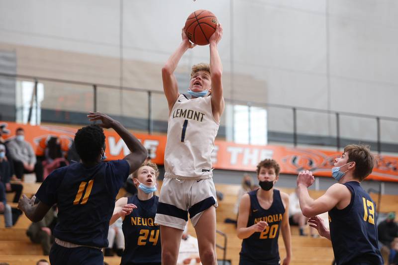 Lemont’s Matas Castillo pulls in an offensive rebound against Neuqua Valley in the Warrior Showdown shootout at Lincoln-Way West. Saturday, Jan. 29, 2022 in New Lenox.