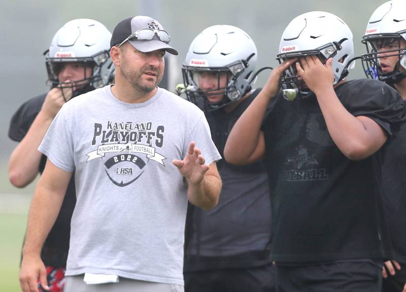 New Kaneland football head coach Michael Thorgesen talks to his players during practice Wednesday, Aug. 9, 2023, at the school in Maple Park.