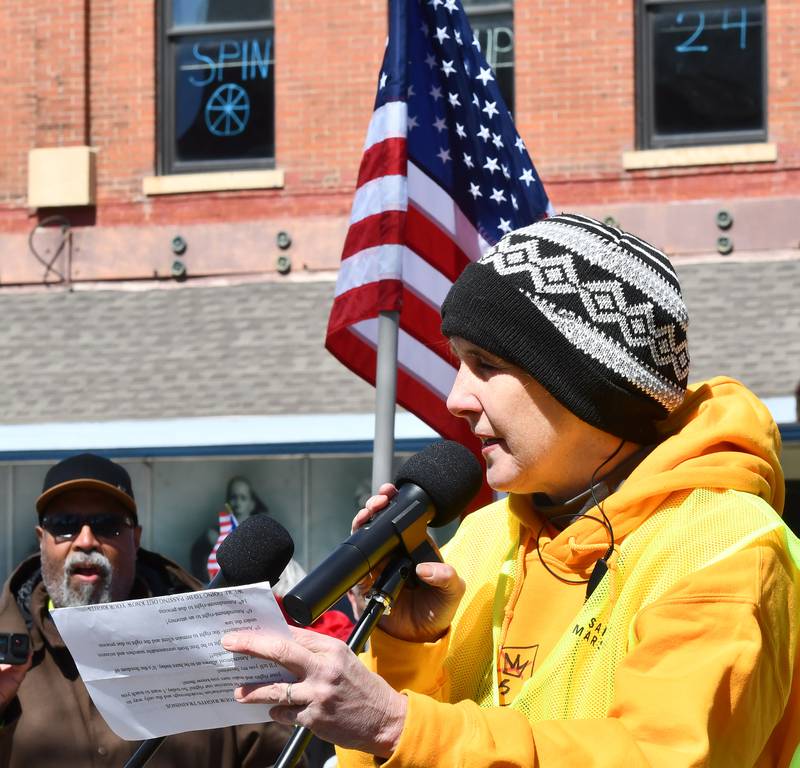 Jan Buttron of Indivisible of Ogle County, addresses the crowd at the start of the No Kings rally on Saturday, March 28, 2026, in downtown Oregon, Illinois.