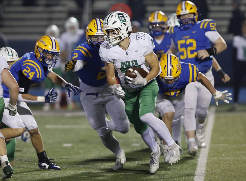 York's Henry Duda (26) runs the ball against Lyons during the varsity football first-round 8A playoff game between York and Lyons Township on Friday, Oct. 31, 2025 in Western Springs, IL.