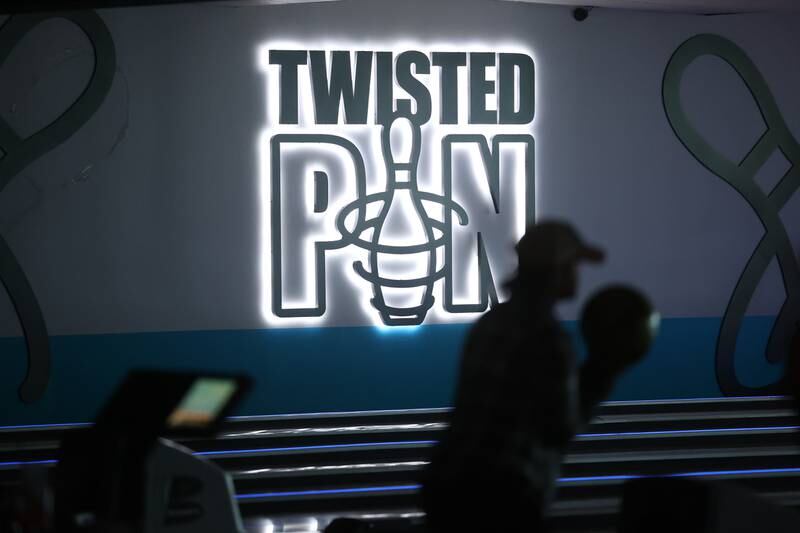 A bowler lines up the ball on a night out at Twisted Pin on Friday, Dec. 1, 2023 in Plainfield.