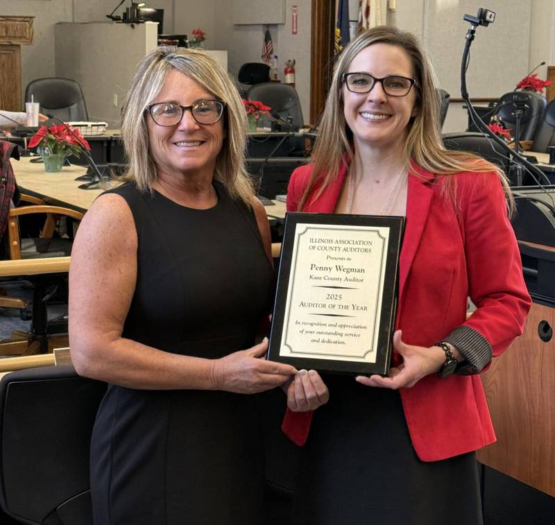 LaSalle County Auditor Stephanie Jo Thompson (left), presented Kane Auditor Penny Wegman with the 2025 Auditor of the Year AWard from the Illinois Association of County Auditors during a Finance Committee meeting Tuesday, Dec. 23, 2025. Thompson is secretary of the association.