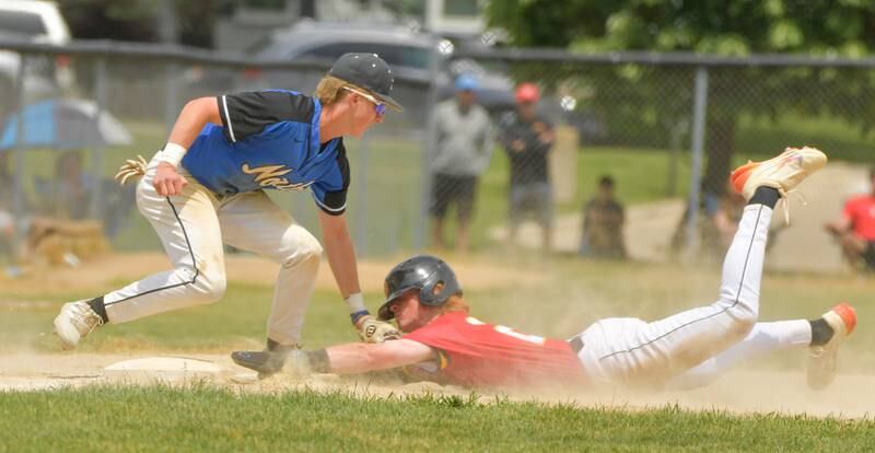 St. Charles North's Jake Kujak (15) makes the out on Batavia's Jackson Bland (26) during the Geneva Regional Championship on Saturday, May 27, 2023.