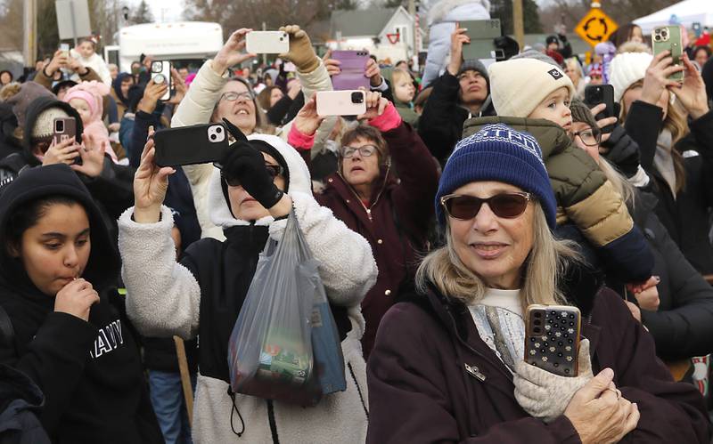 People photograph the Canadian Pacific Kansas City Railway 2024 Holiday Train on Wednesday Nov. 27, 2024,  as the train pulls into Pingree Grove. The holiday train raised food and monetary donations for the D300 Food Pantry during its stop in Pingree Grove.