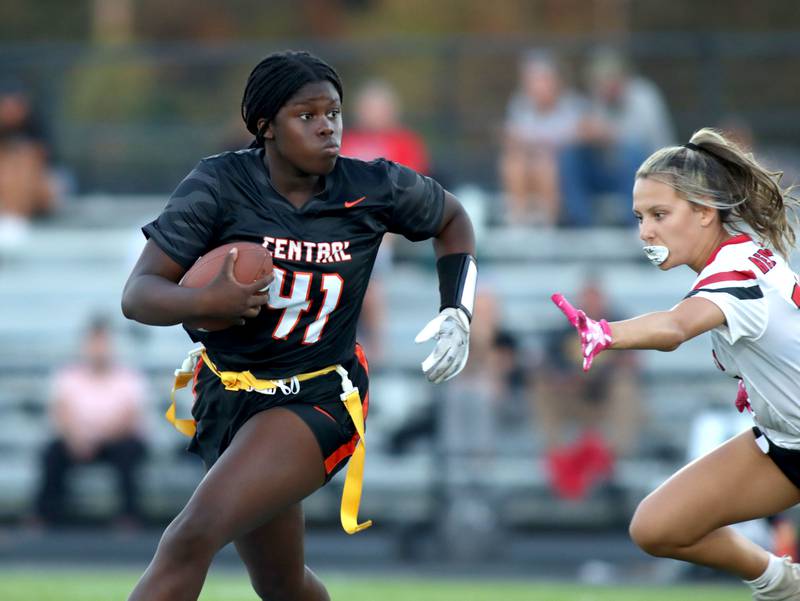 Crystal Lake Central’s Pekun Bolarin runs the ball against Huntley in varsity flag football at Owen Metcalf Field on the campus of Crystal Lake Central High School in Crystal Lake on Tuesday, Sept. 16, 2025.